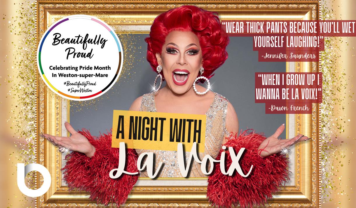 La Voix smiling as she appears from a golden photo frame