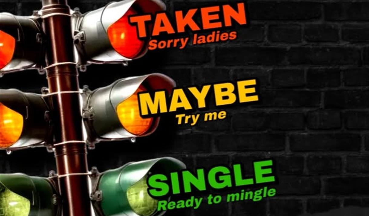 Traffic light with the red light saying, Taken, the amber light saying maybe, try me and the green light saying single, ready to mingle. The poster is
