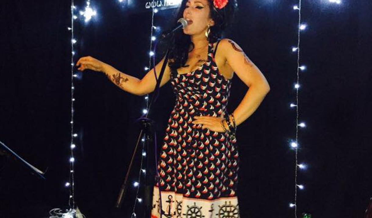 Jo McNabb as Amy Winehouse