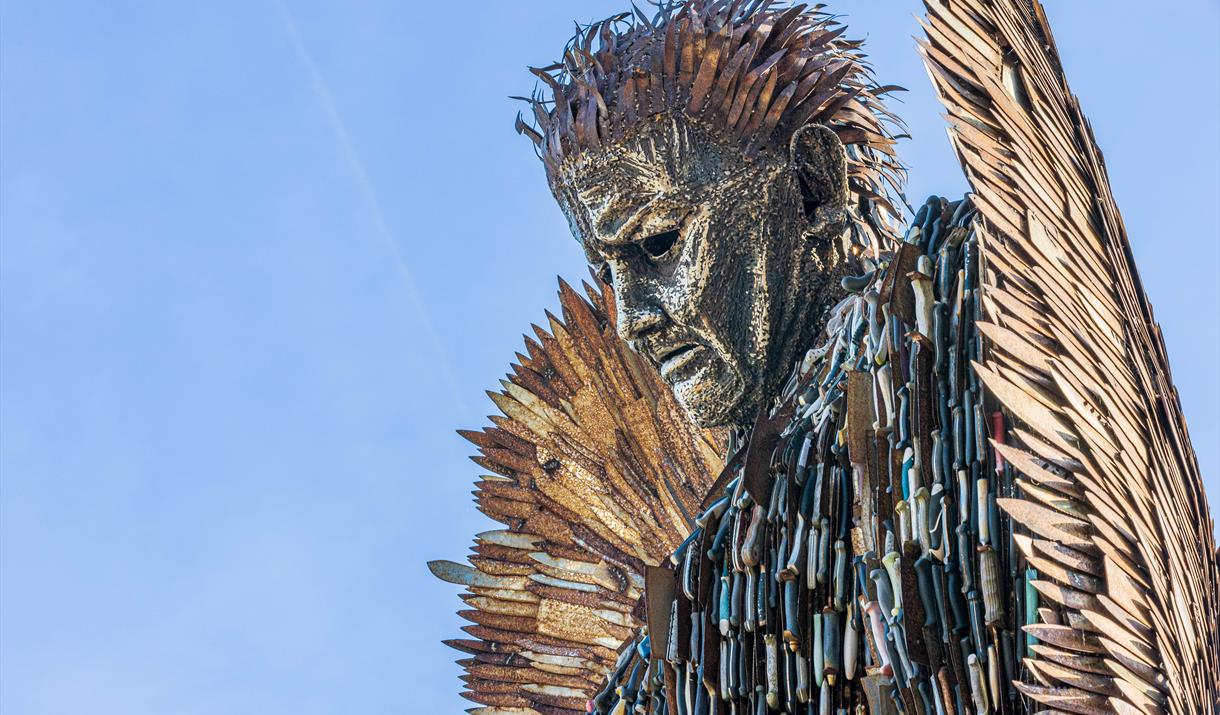 A statue depicting an angel which has been made out of knives and blades