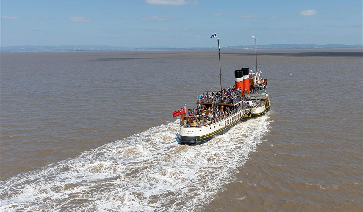 A paddle steamer out at sea