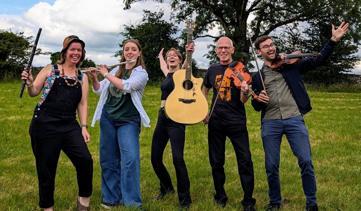 The five members of the Barnstormers band with their instruments