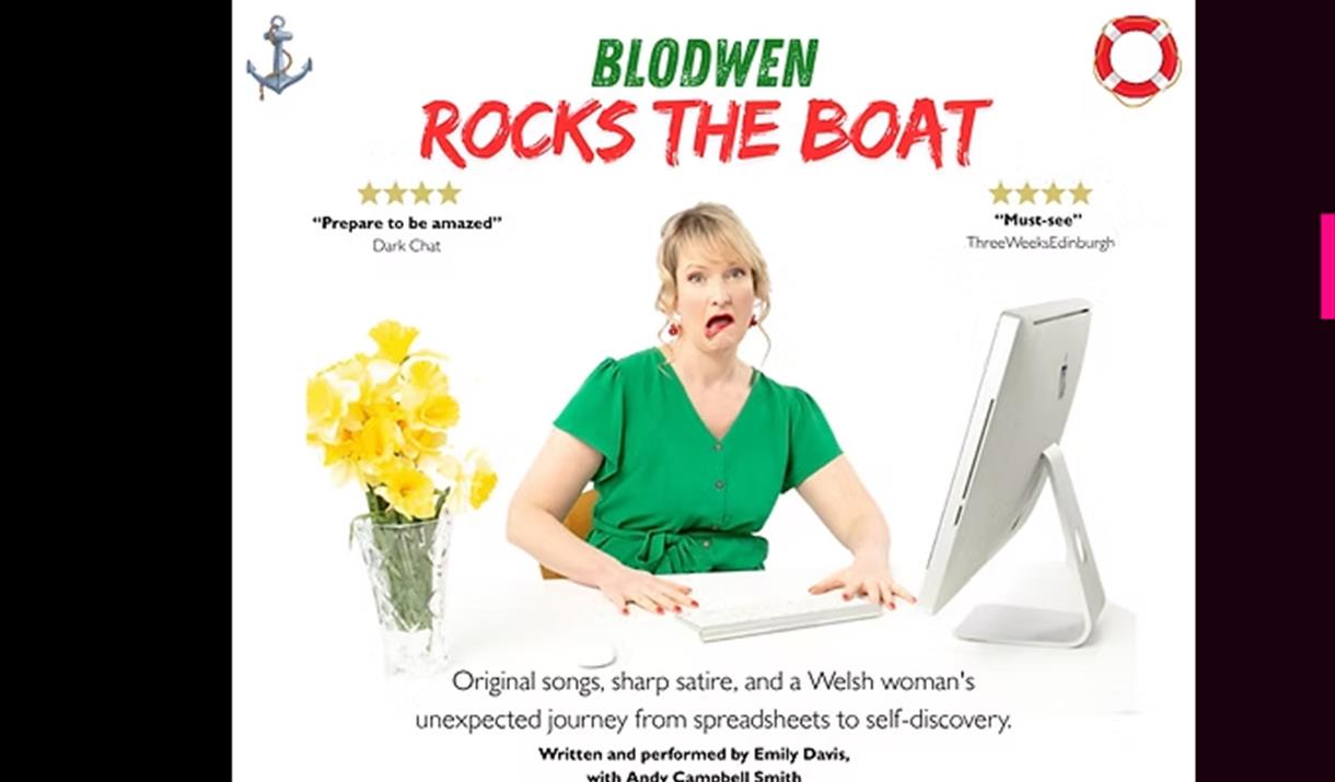 Woman in green dress pulling a face at her computer