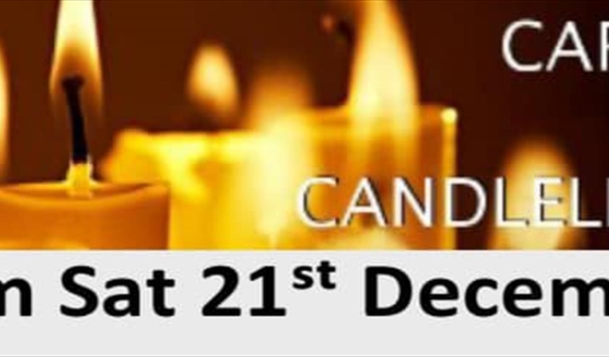 Poster advertising a carols by candlelight service featuring a picture of burning candles