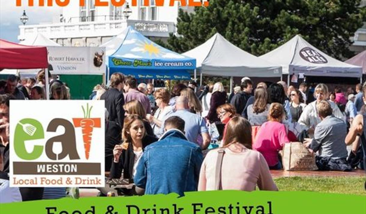 Crowds of people at a food festival with gazebos in the background