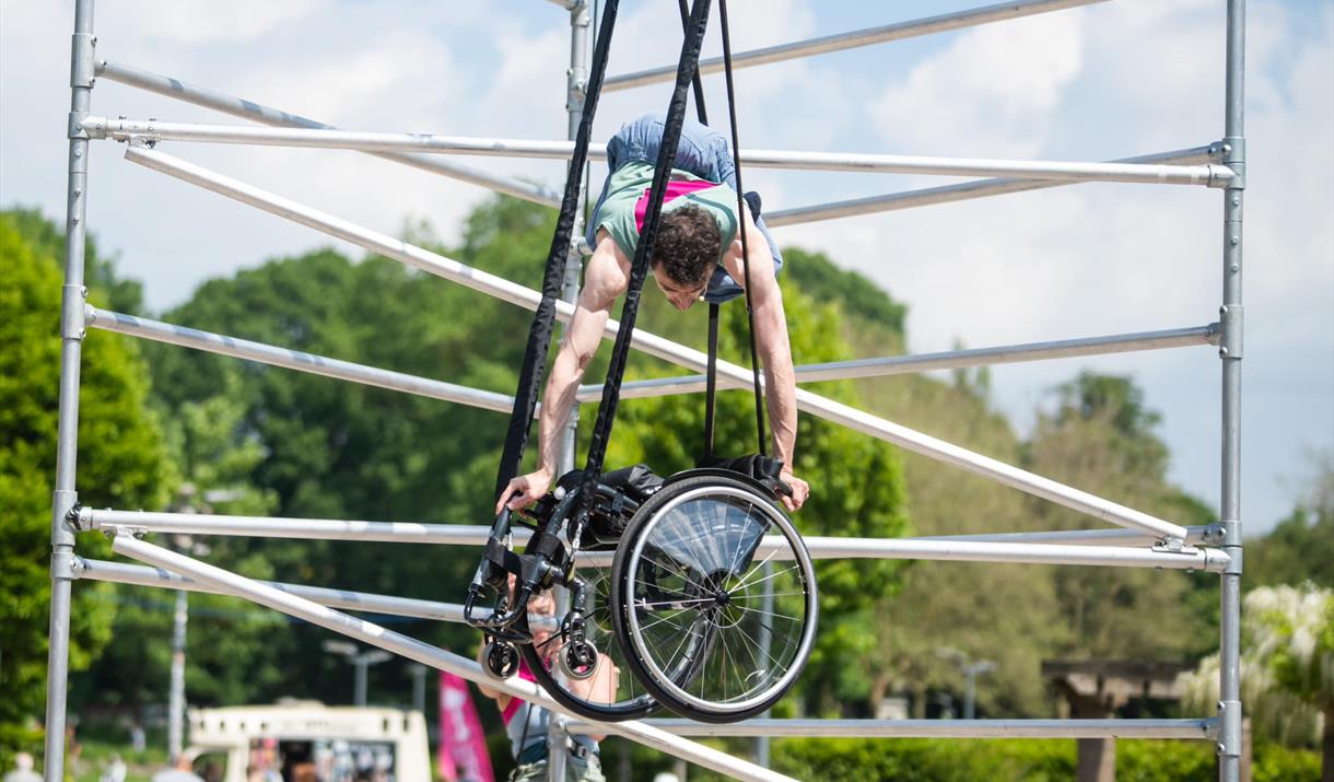 A man anchored in air on a wheelchair