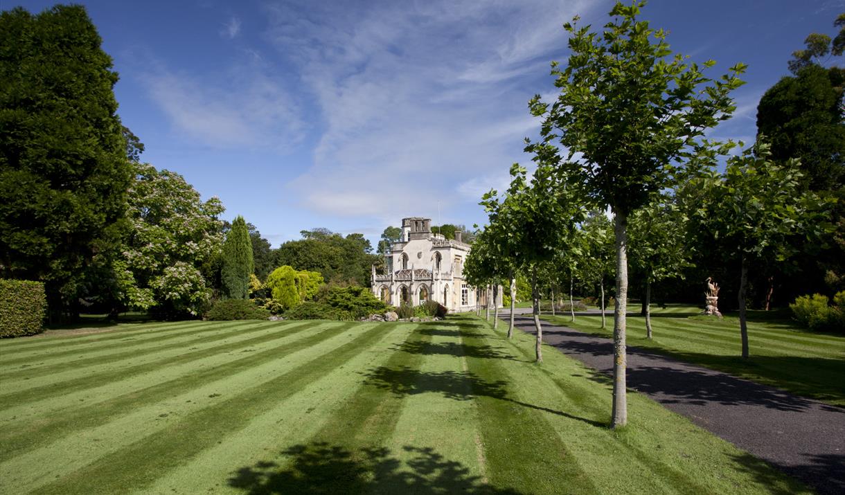 Lympsham Manor Garden photograph with beautiful green lawns and the Manor.