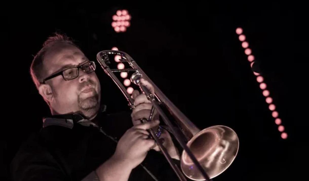 Photograph of Jon Hope with trombone