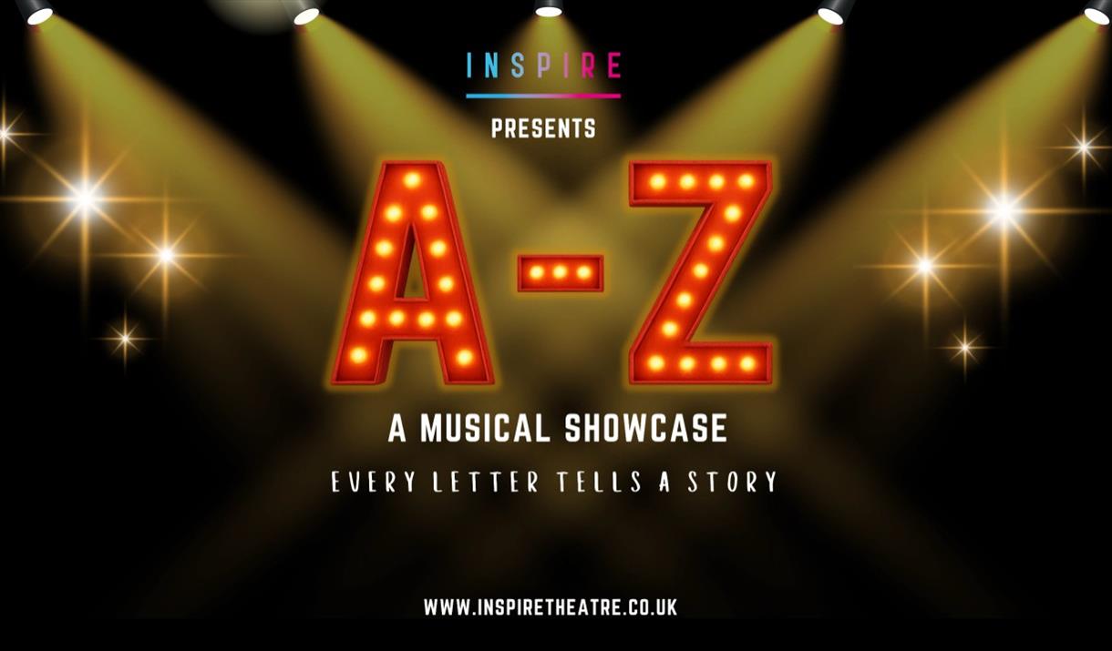 Four spotlights picking out the letters A-Z on a poster