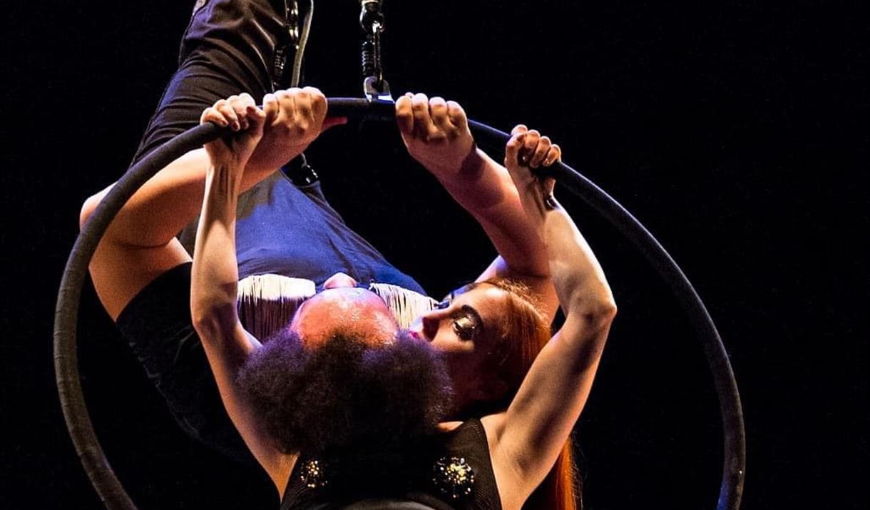 Two acrobats in a hoop