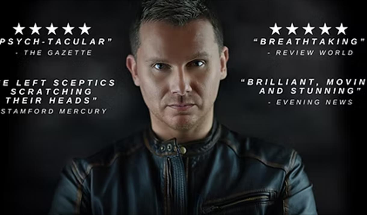 Mug shot of psychic Stuart Michael with text either side