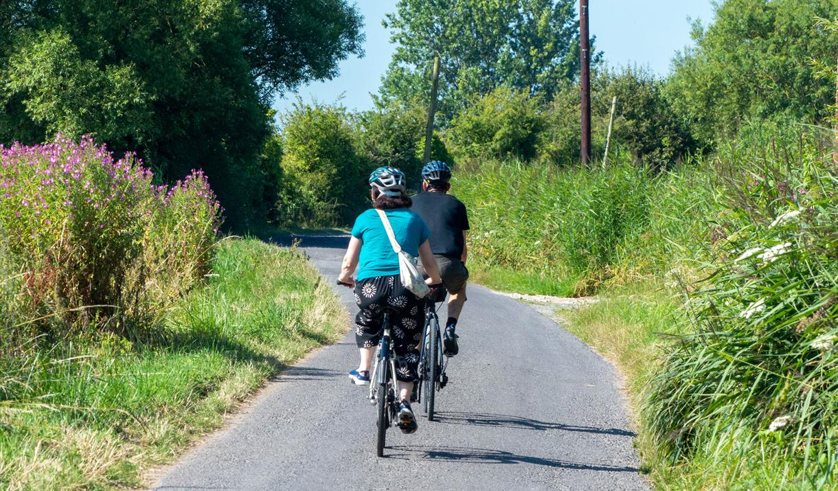 Two cyclists on a pretty cycle route