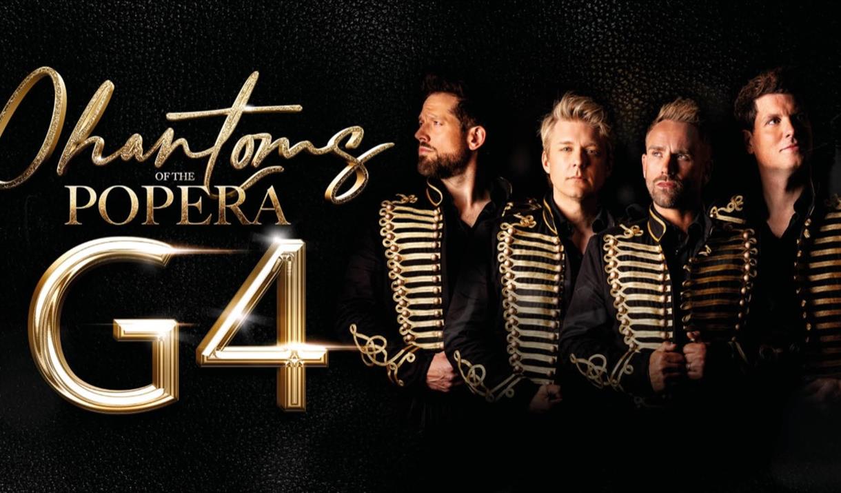 Four men from group G4 in identical black suits with gold braiding