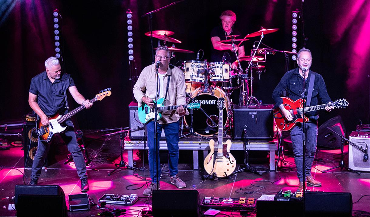 Members of the Eastertown band performing on stage at the Grand Pier, Weston-super-Mare