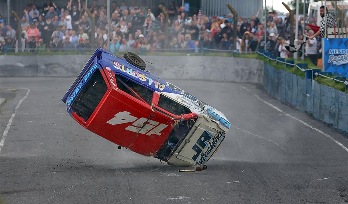 An upside-down banger racing car lands on its front headlight