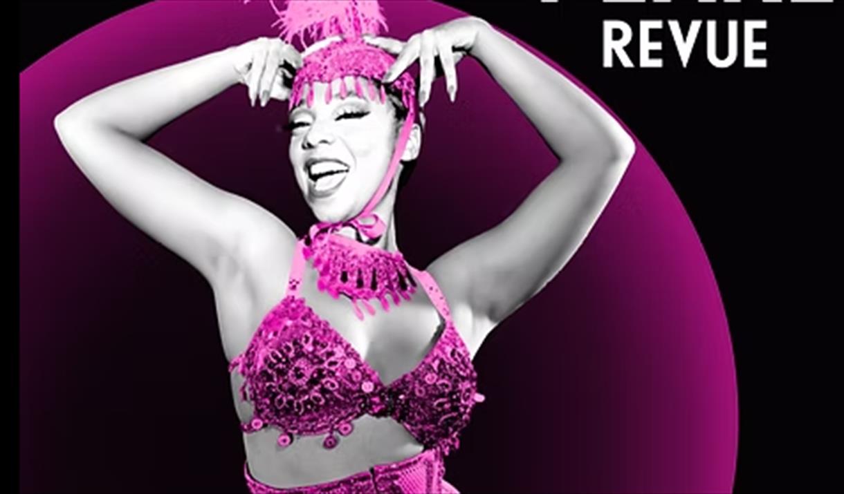 A burlesque performer dressed in pink