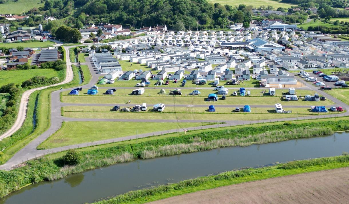 Aerial View of the Riverside Holiday Village at Weston-super-Mare with a river running through it