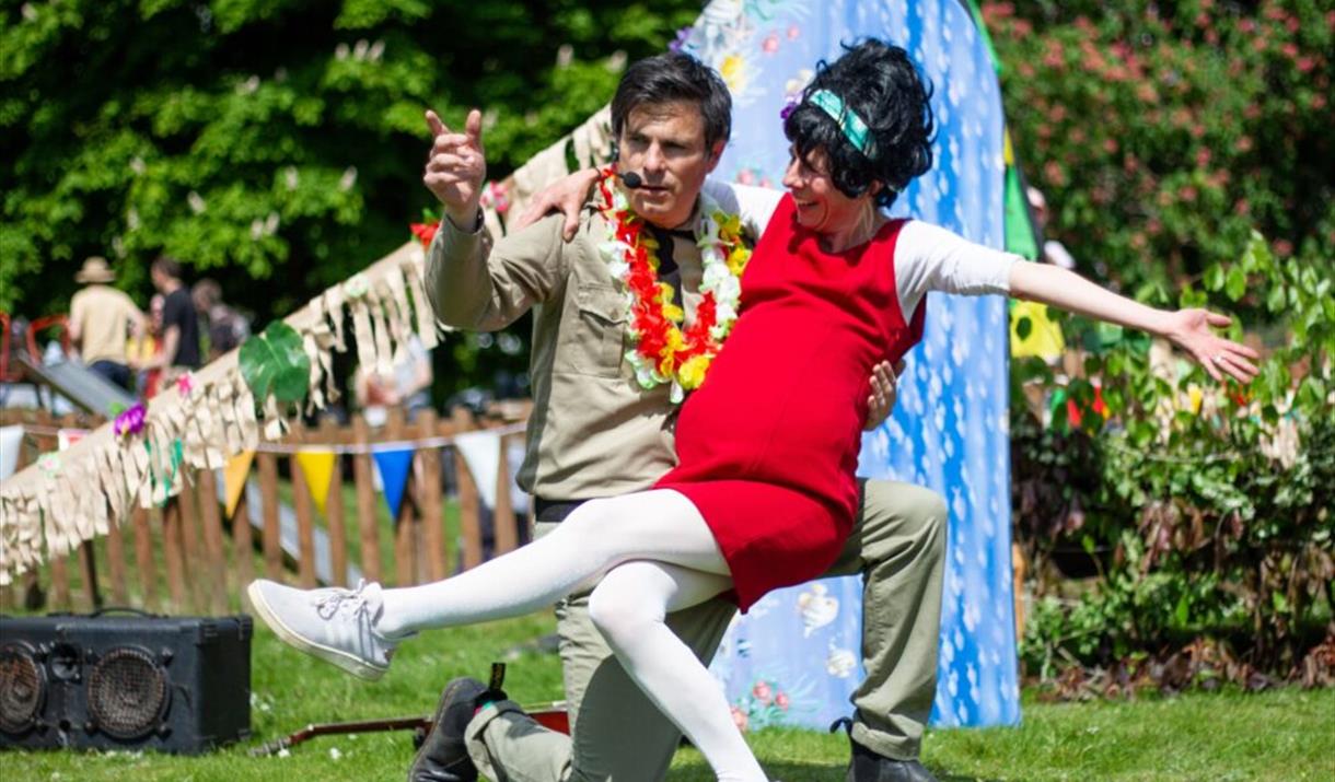 A photograph of an Elvis impersonator with his assistant.