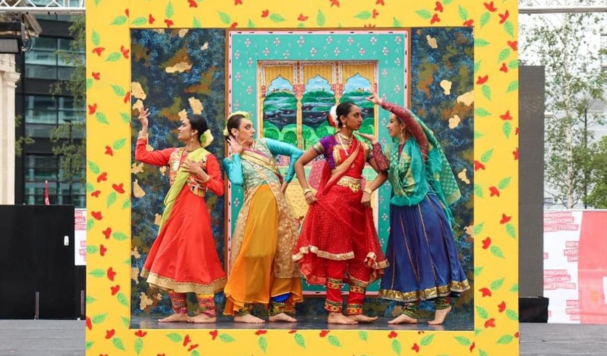 Group of South Asian ladies dancing