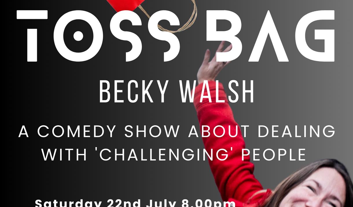 Tossbag - photograph of Becky in a red jacket, throwing a red paper bag into the air.