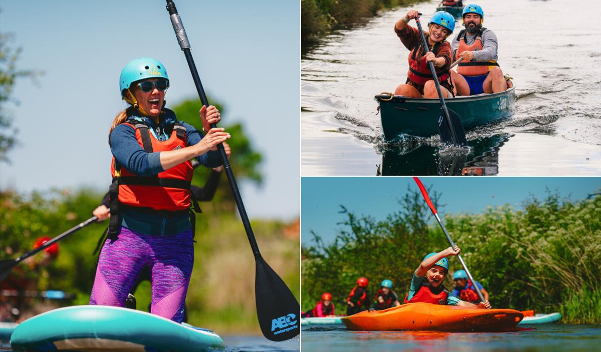 People enjoying water sports including paddleboarding, canoeing, and kayaking at Mendip Activity Centre on a sunny day.
