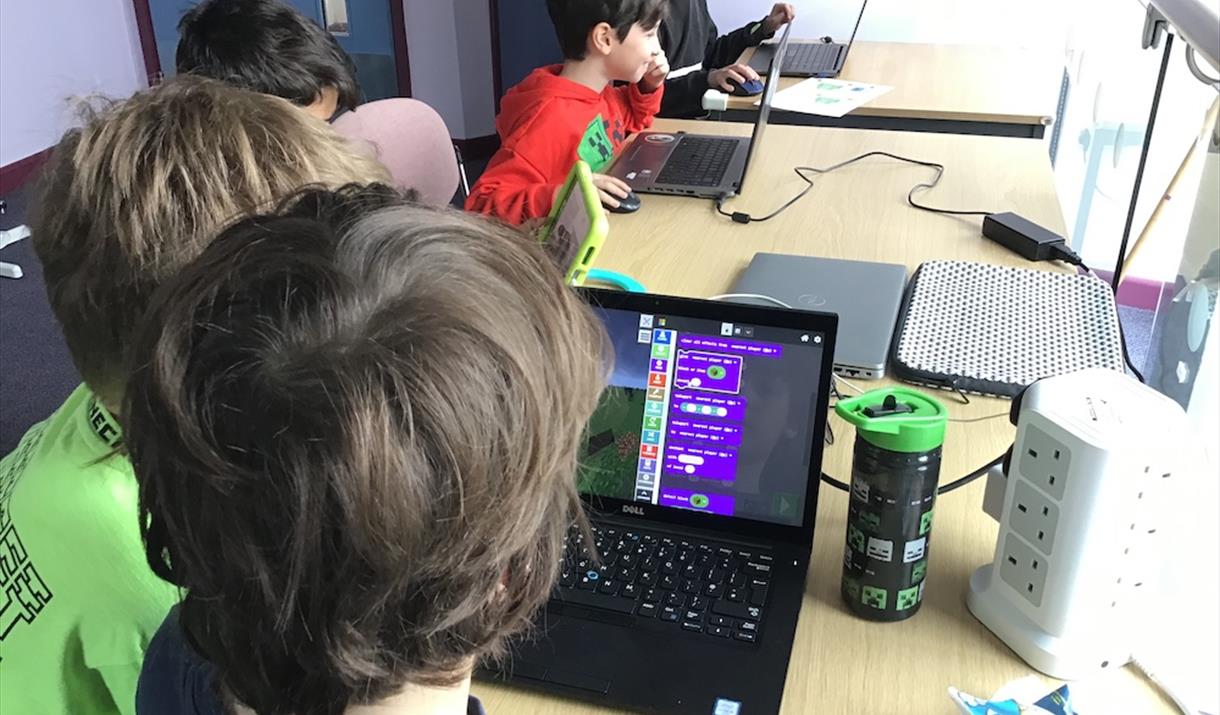 Children coding in Minecraft Education
