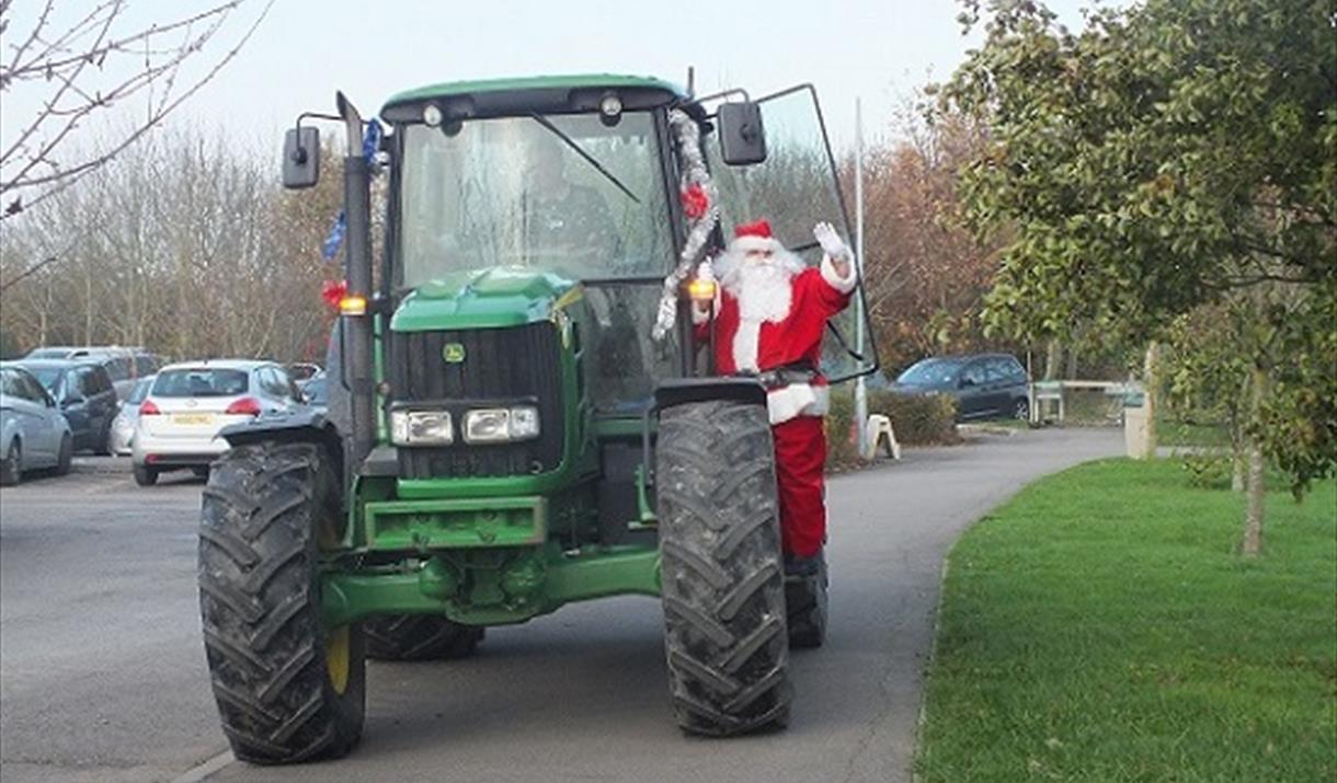 Santa Arrives by Tractor