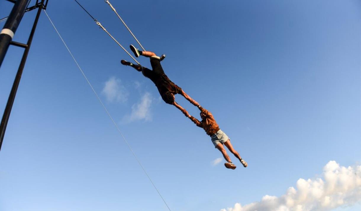 Acrobatics swinging in the air on high ropes