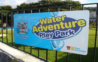 Sign on the railings saying Water Adventure Playpark