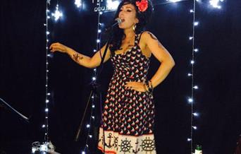 Jo McNabb as Amy Winehouse