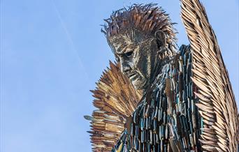 A statue depicting an angel which has been made out of knives and blades
