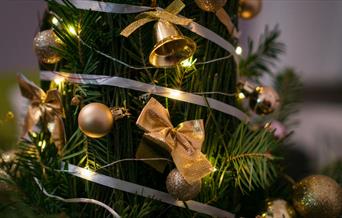 Gold decorations on a Christmas tree