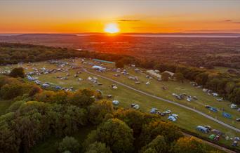 Aerial view of Mendip Basecamp at sunset