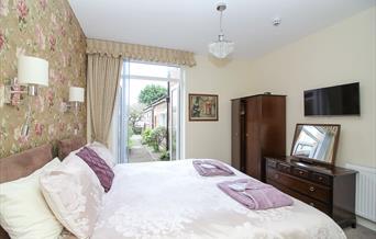 The Beach House bedroom in the ground floor apartment