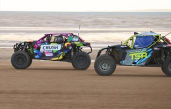 Two SXS Sand Buggies racing along Weston-super-Mare beach