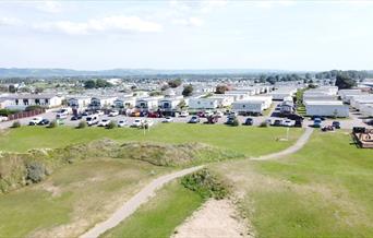 Aerial view of a holiday park and sand dunes