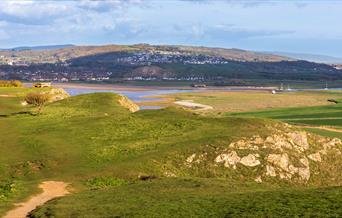 Scenic view from the top of Brean Down looking back over the summit of the Down and over the  estuary towards Bleadon
