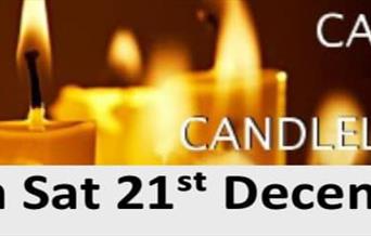 Poster advertising a carols by candlelight service featuring a picture of burning candles