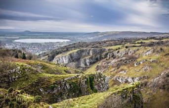 View over the top of a gorge with a circular reservoir