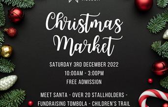 A poster with details of the market surrounded by baubles and pine leaves