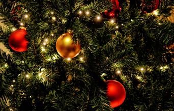 Christmas baubles and lights on a tree