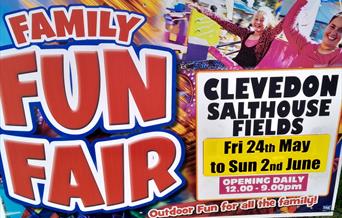 Brightly coloured poster advertising a fun fair