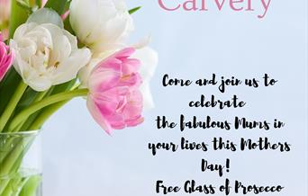 Mother's Day image with a photograph of tulips in a vase.