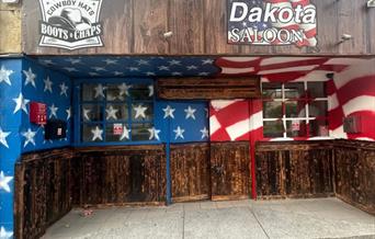 The outside view of Weston-super-Mare's Dakota Saloon bar decorated in starts and stripes.