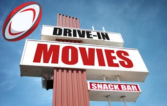 An American-style Drive-In movies sign with a rugby ball super-imposed on it