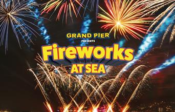 Fireworks at Sea poster with image of fireworks from the Grand Pier and yellow writing.