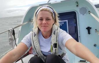 Photograph of Gemma Best, rowing in her boat.