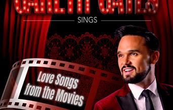 Picture of pop star Gareth Gates wearing a smart suit. The photo is imposed on a theatre poster advertising his Love Songs From The Movies show at The