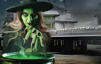 A witch with her cauldron outside the Grand Pier Weston-super-Mare