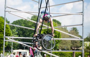 A man anchored in air on a wheelchair